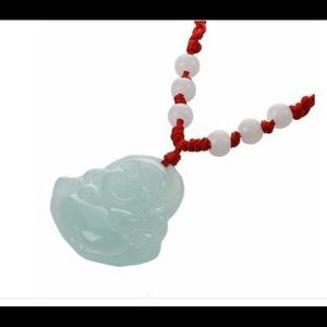 Selling Buddha pendants with red strings